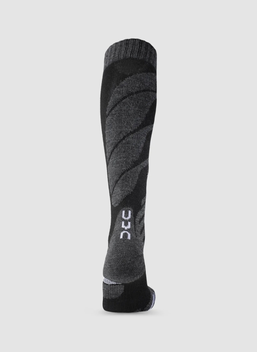 Czarne skarpety narciarskie UYN Junior Ski Socks z technologią Preshock Shield, widoczne z tyłu.