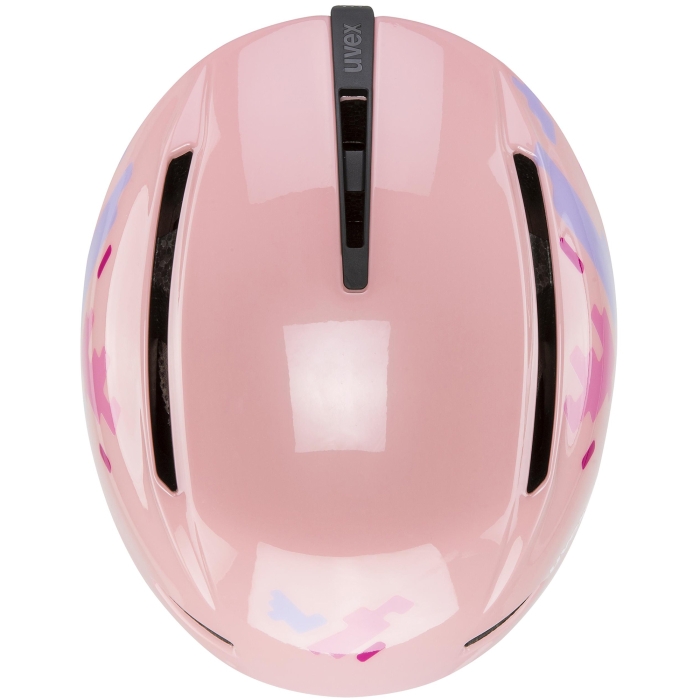Kask UVEX Viti dziecięcy, różowy, ujęcie z góry. Widoczne rozmieszczenie otworów wentylacyjnych.