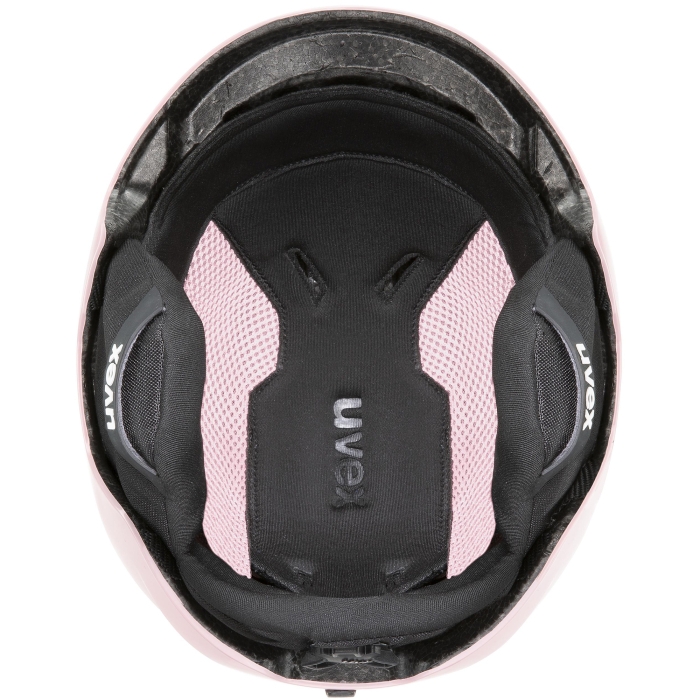 Kask fotografowany z góry. Widoczna symetria otworów wentylacyjnych i jasnoróżowy, gładki materiał.