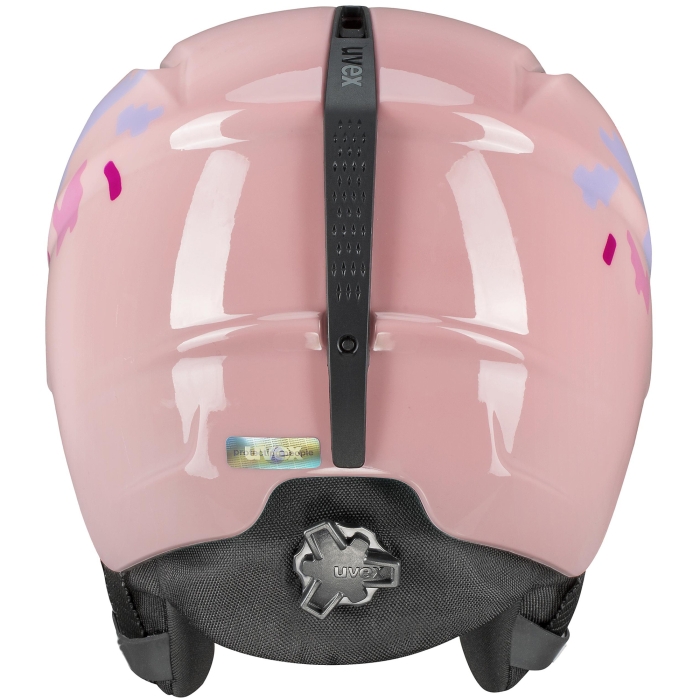 Kask fotografowany z góry. Widoczna symetria otworów wentylacyjnych i jasnoróżowy, gładki materiał.