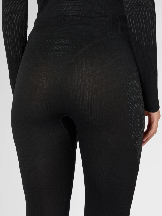 Zbliżenie na tył damskich getrów UYN 3/4, widoczne strefy Durafit na kolanach i elastyczny pas.